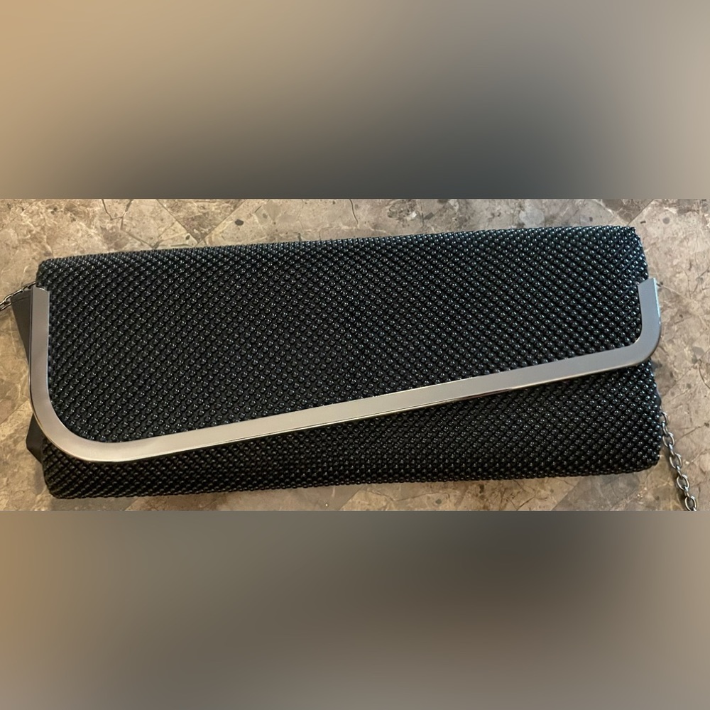 Black beaded clutch with gunmetal accents.